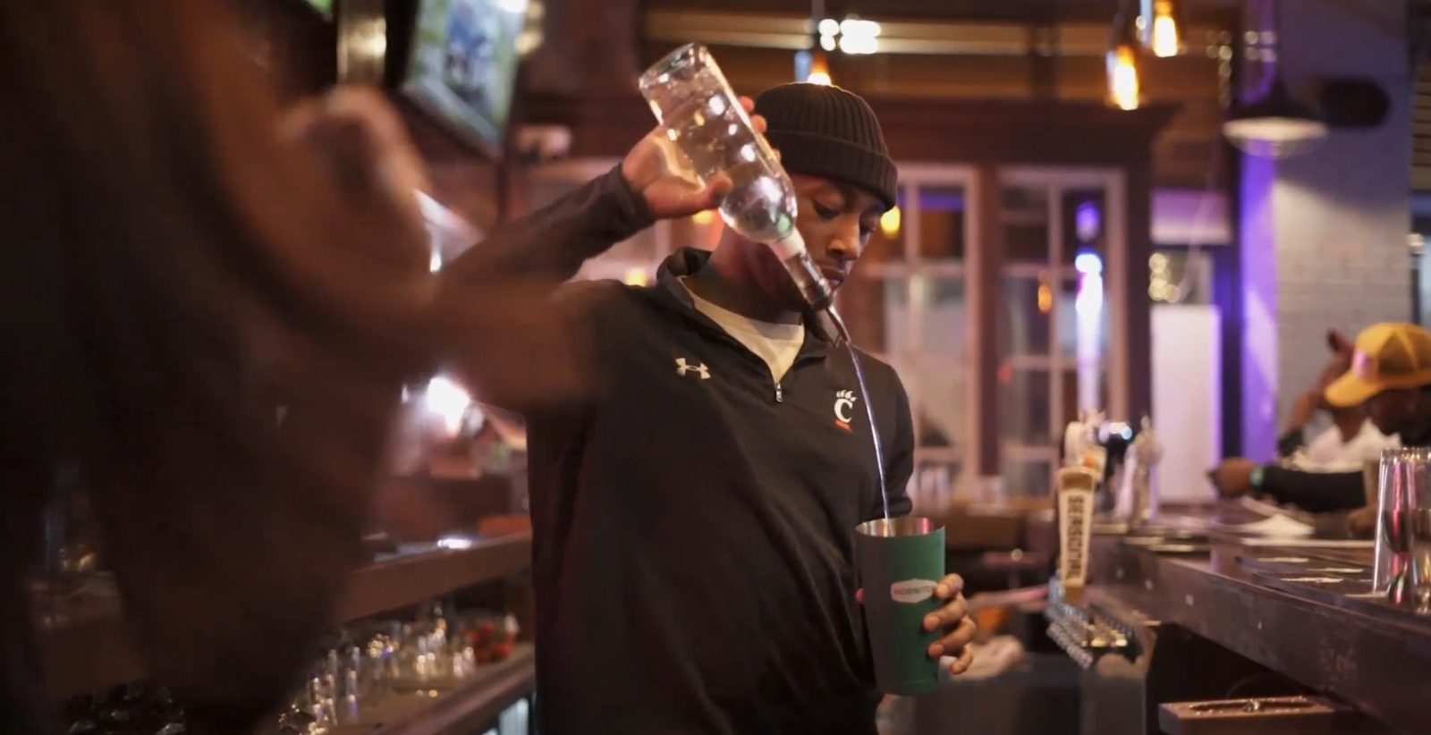 Bartender Pouring Drinks at Saturn's Sports Bar